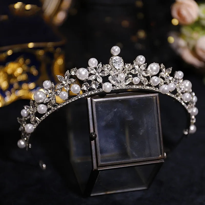 Silver bridal tiara with pearl beads and rhinestone floral design; square crystal centerpiece