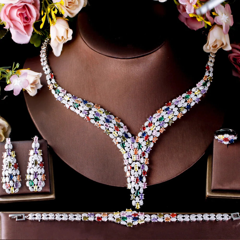 Multicolor cubic zirconia V-necklace with matching earrings and bracelet on display