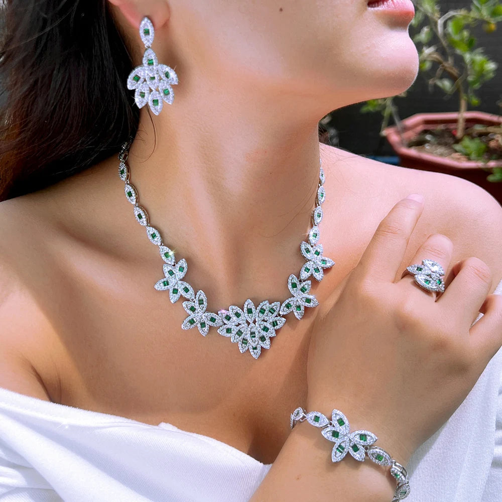 Green zirconia floral jewelry set: layered necklace, drop earrings, ring and bracelet