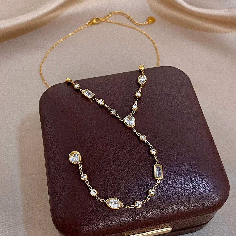 Gold-tone Y choker necklace with oval and rectangular crystal links