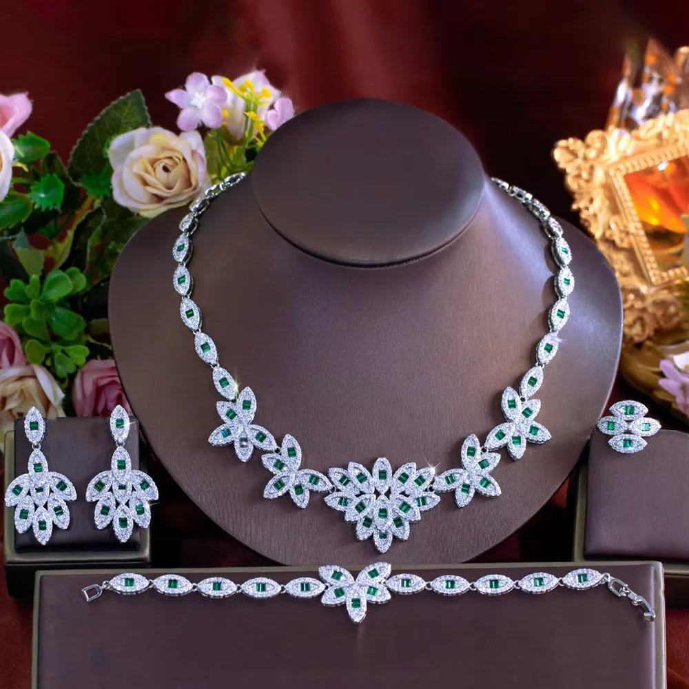 Green zirconia floral jewelry set on display: necklace with matching drop earrings and bracelet