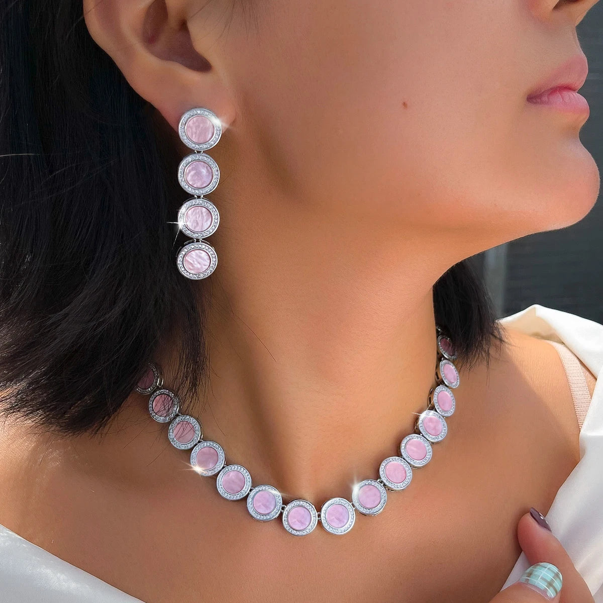 Pink oval link necklace and matching drop earrings, silver-tone bezel details