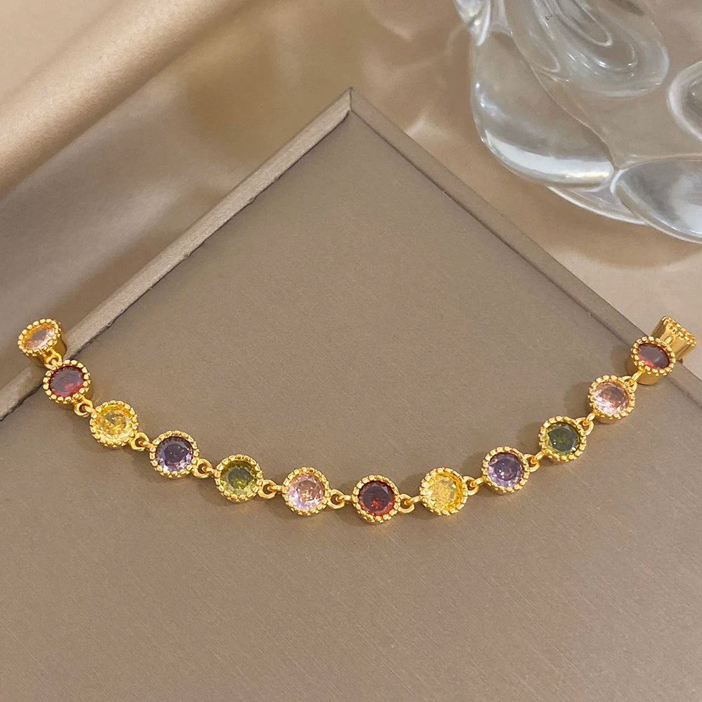 Gold-plated zirconia bead bracelet with multicolor round stones and heart clasp