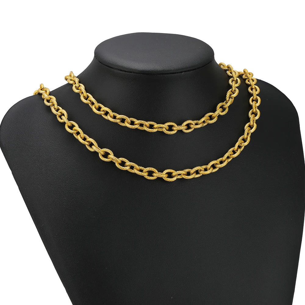 Gold chunky chain choker with textured oval links on a black mannequin bust
