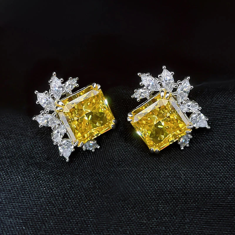 Yellow square cubic zirconia studs with clear crystal cluster halo, close-up