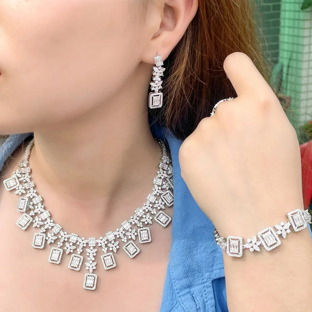 Sparkly rhinestone statement necklace with matching drop earrings, silver-toned
