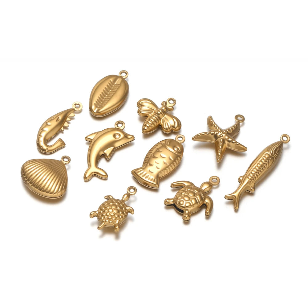 Gold-toned ocean animal hollow charm set, fish, dolphins, turtle, starfish, turtle