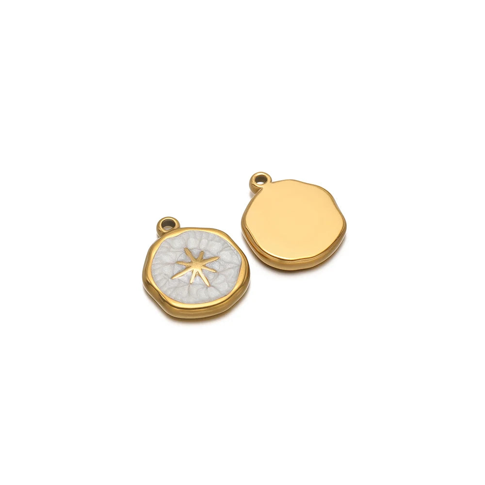 Gold-tone round charm with white star enamel, plus blank gold-tone round charm