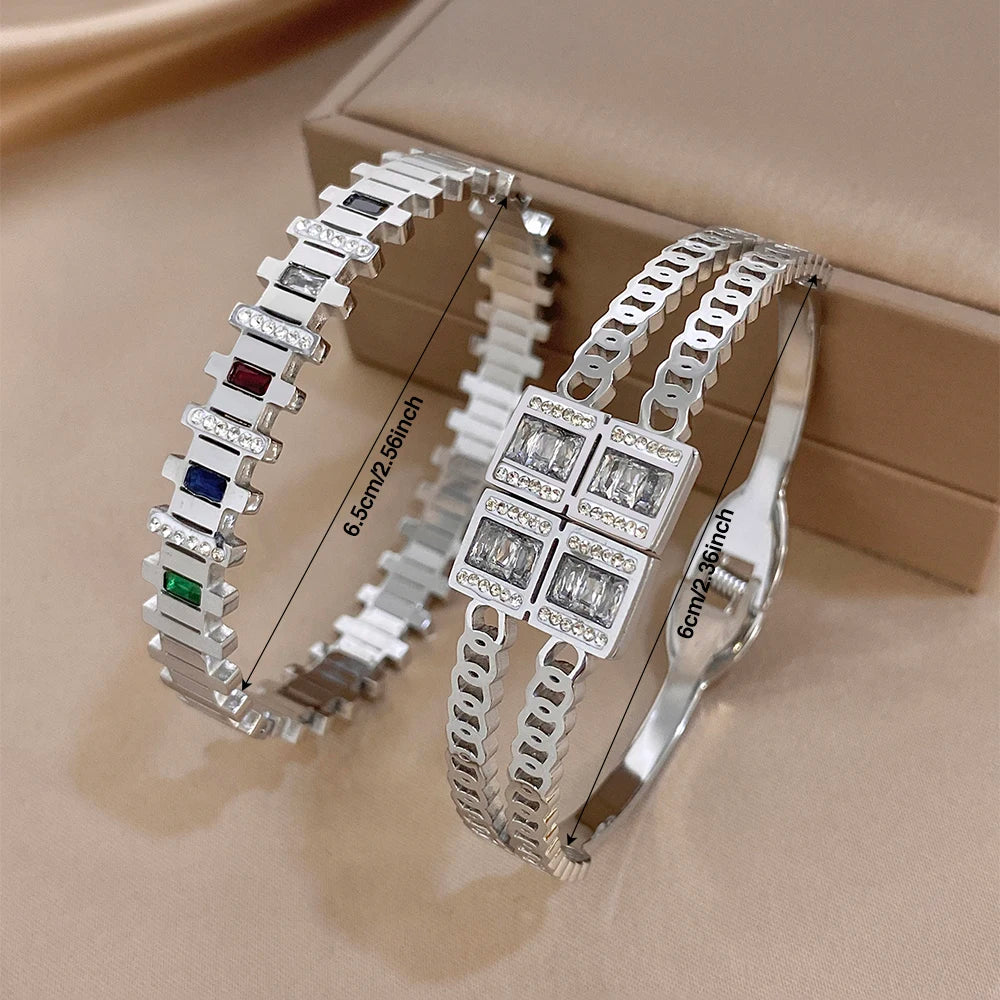Stacked view of silver-toned zircon cuff bangles with multicolor rectangular stone accents