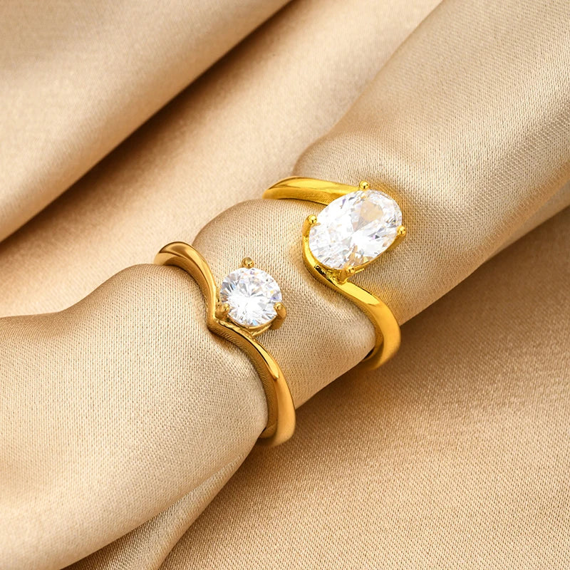 Gold-tone open-band rings with round cubic zirconia stones stacked
