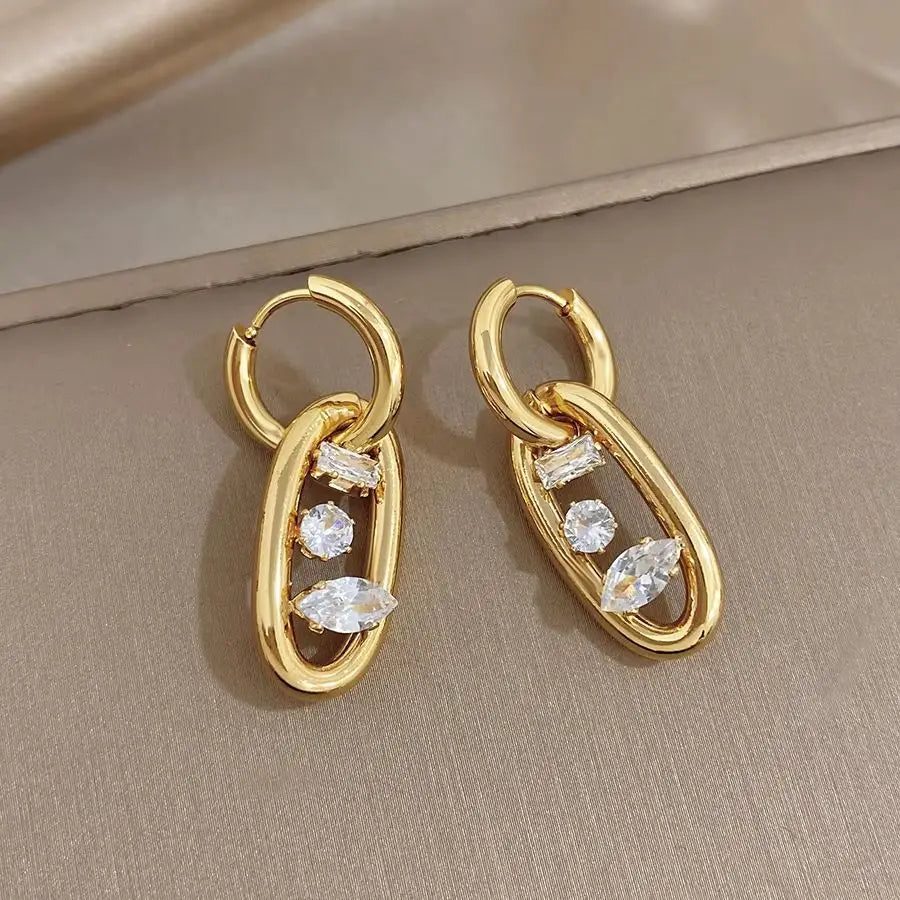 Gold-plated hoop earrings with oval zircon drops