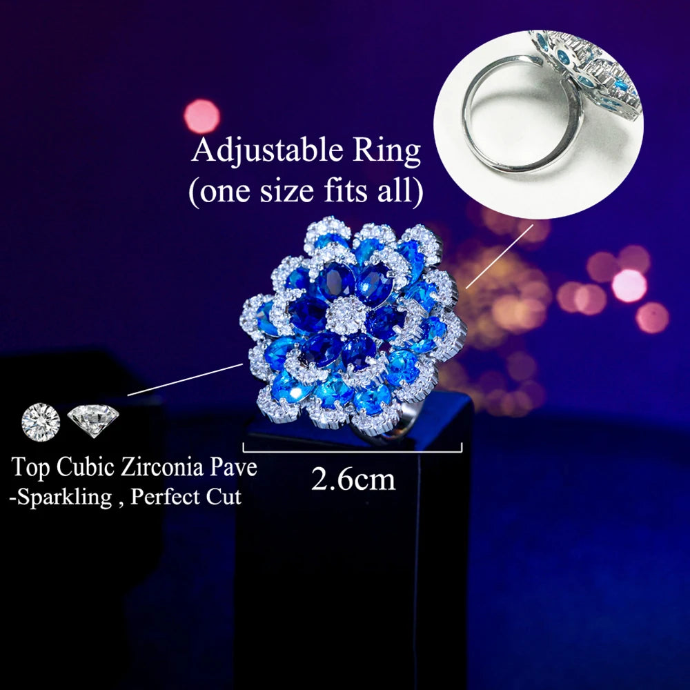 Blue cubic zirconia flower ring with adjustable band and 2.6 cm face