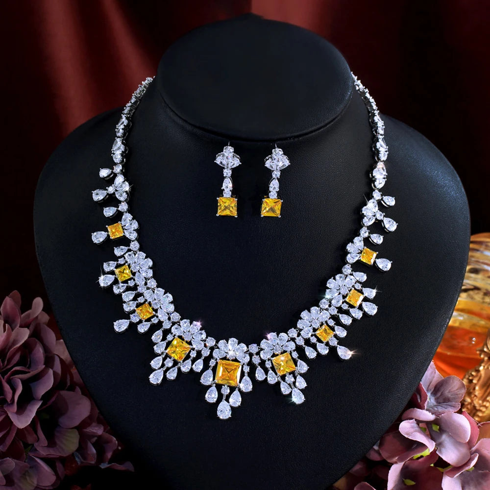 Cubic zirconia necklace with matching drop earrings, yellow square stones, silver-tone.