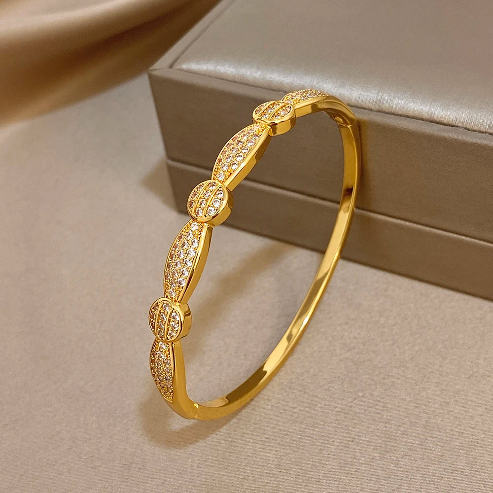 Gold-tone rhinestone oval-link cuff bracelet on display box