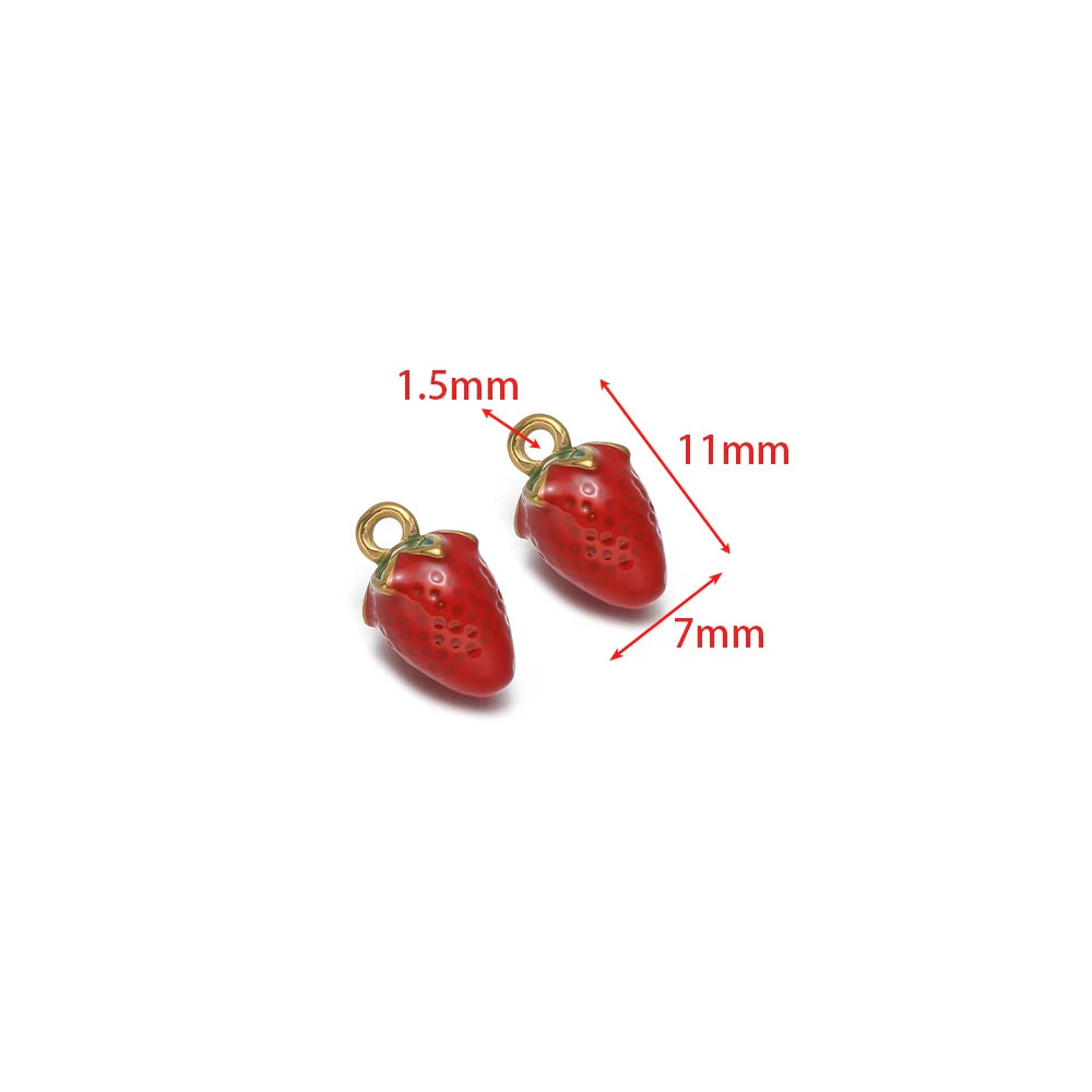 Red strawberry-shaped drip enamel charm with gold-tone loop and ring
