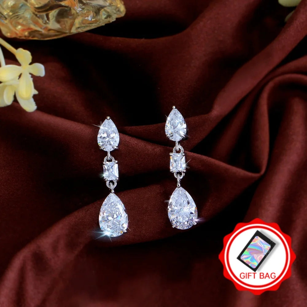 Pair of crystal teardrop earrings with linked stones; gift bag included.