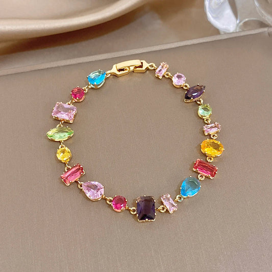 Gold-plated geometric zirconia link bracelet with colorful oval and square stones, clasp.