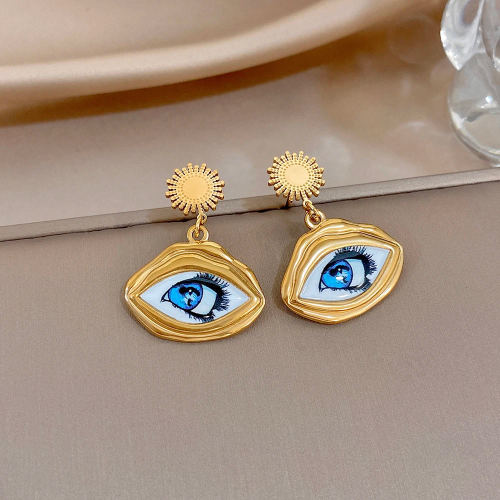 Gold-tone evil eye drop earrings with sunburst studs and teardrop oval eye pendants