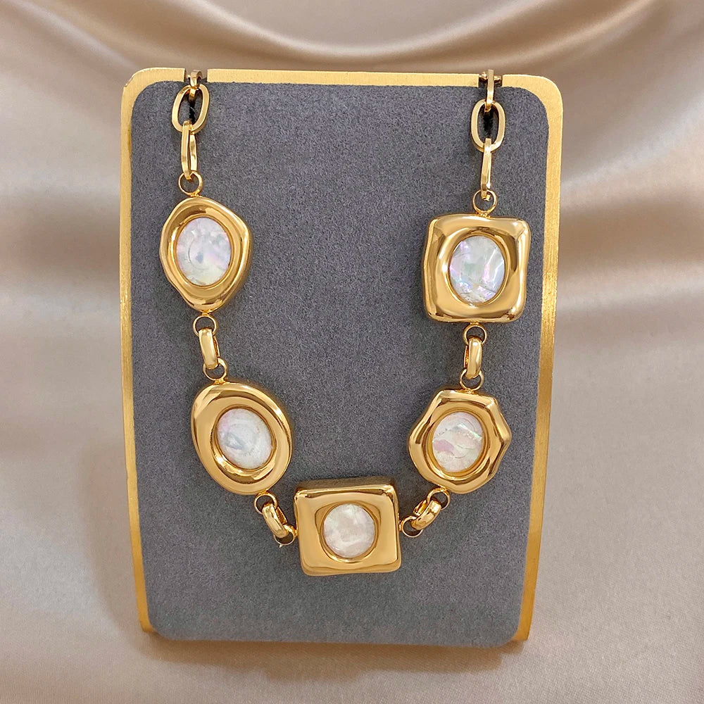 Gold-plated geometric shell bead bracelet with square and oval white inlay links