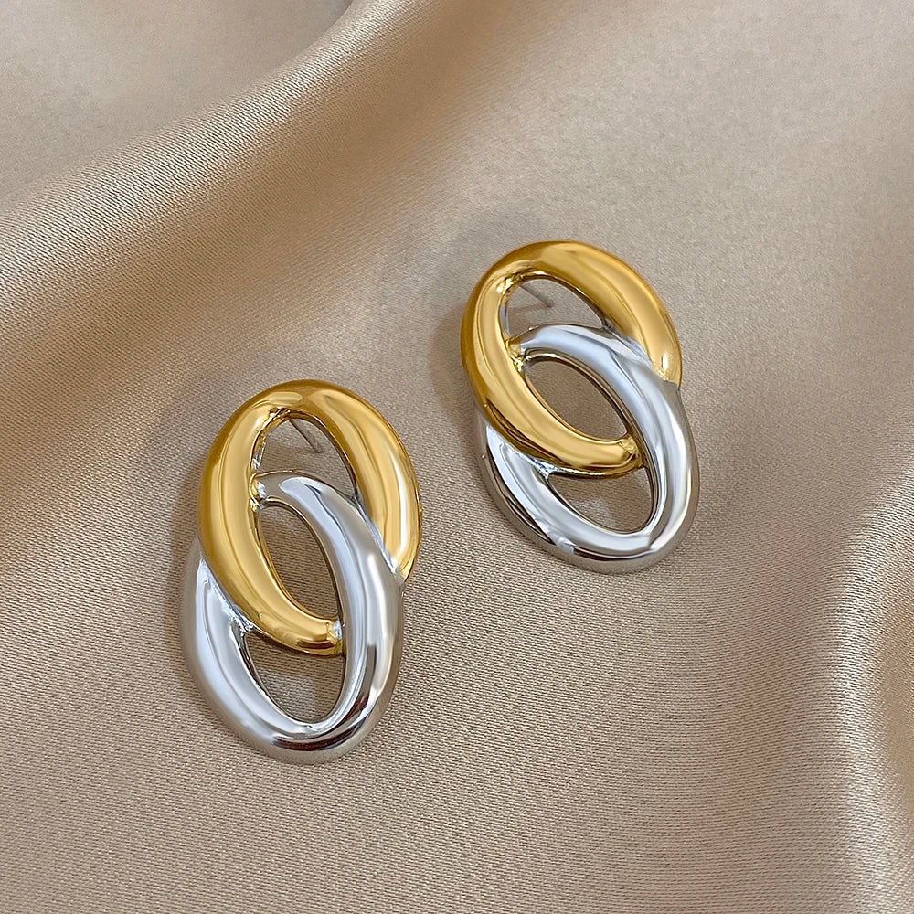 Interlocking gold and silver-tone oval link earrings