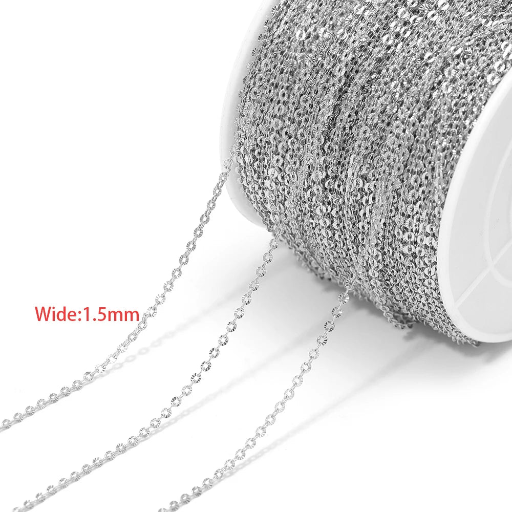 Fine silver textured chain mesh cord on a spool with hanging links