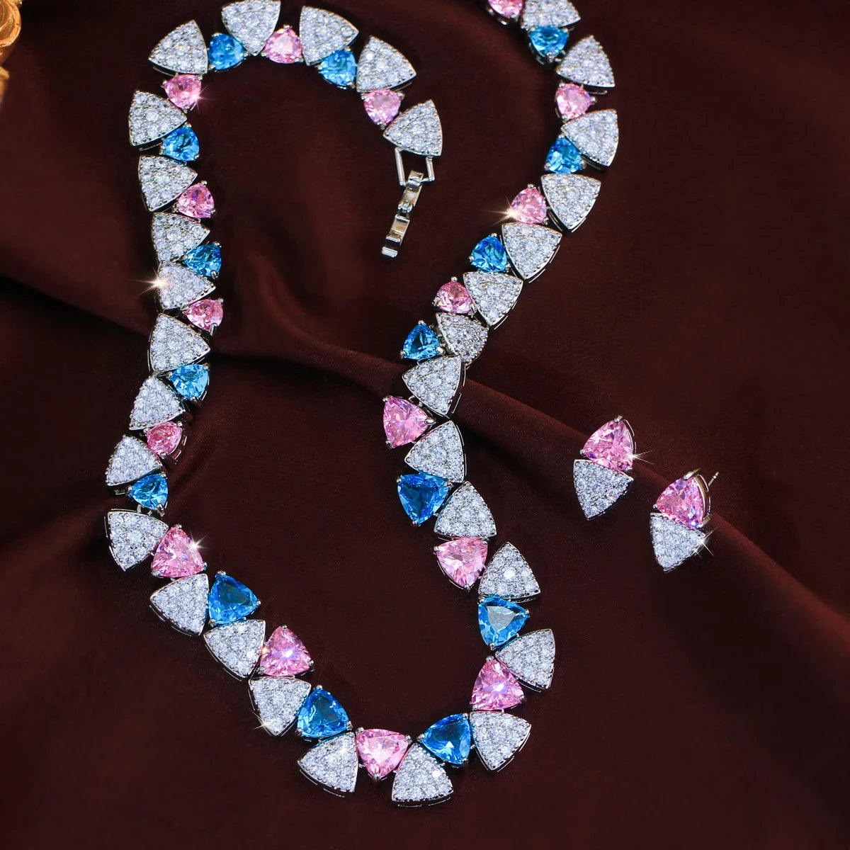 Triangle cubic zirconia necklace and earrings with blue, pink, and clear stones