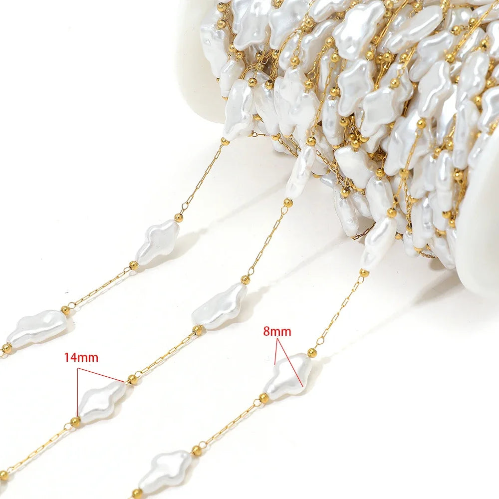 Artificial pearl chain with gold links and 14mm white oval beads