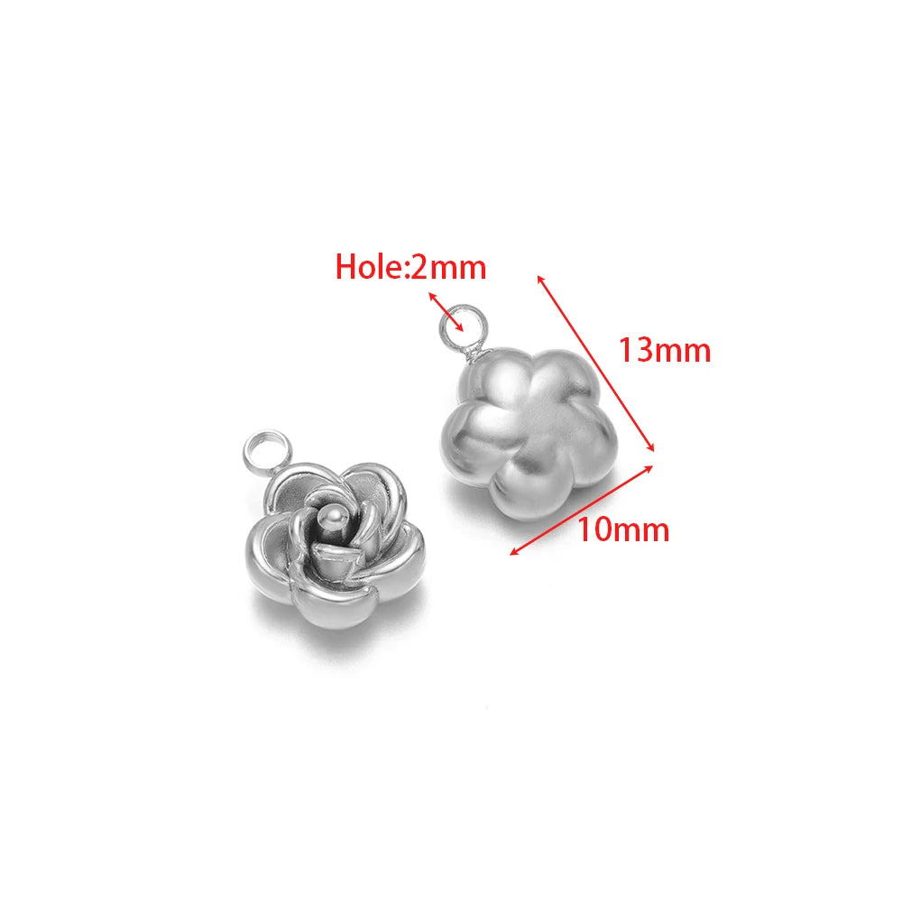 Silver-tone rose flower charm pendant with top loop, close-up detail