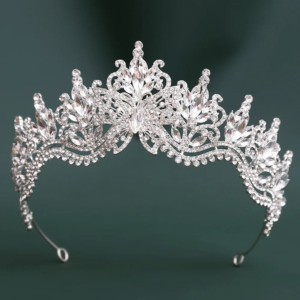 Silver rhinestone tiara with large clear crystal cluster and ornate side scrolls