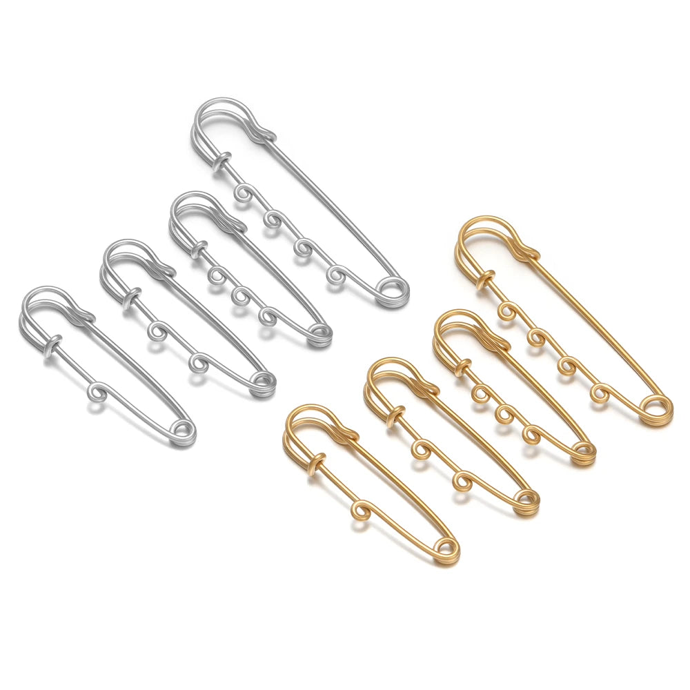Multi-hole safety pin brooch fasteners in silver and gold, grouped view