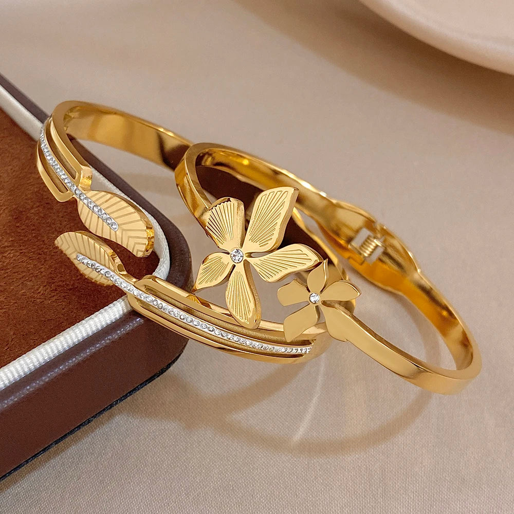 Gold plated cuff bangles with leaf and flower accents