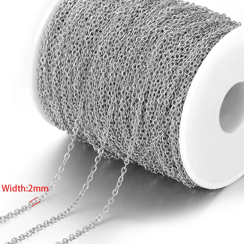 Silver stainless steel chain links on a spool, 2mm width with dangling segments