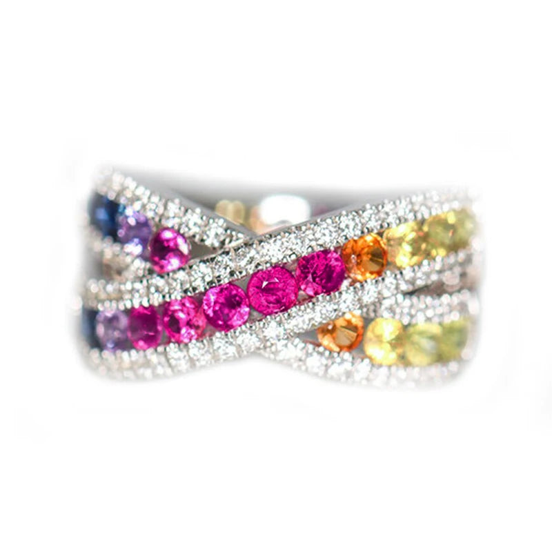Rainbow CZ crossover ring with silver-tone pavé bands and multicolor stones
