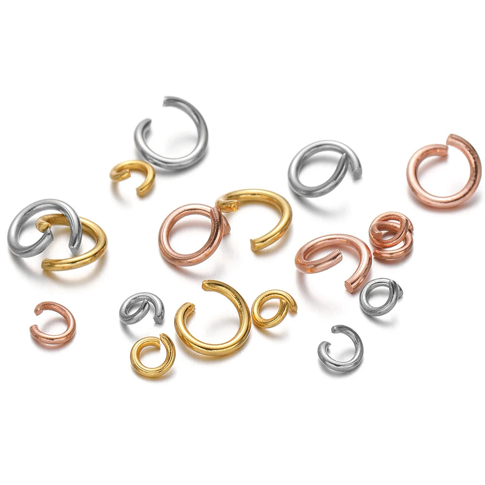 Assorted split jump rings in silver, gold, and rose gold for jewelry making