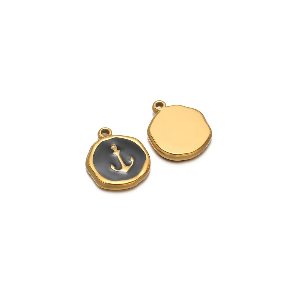 Gold-tone round charm with dark anchor enamel, plus blank gold-tone round charm