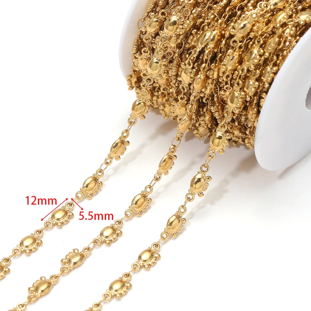 Gold-tone starfish charm chain with oval links, approx 12mm and 5.5mm spacing