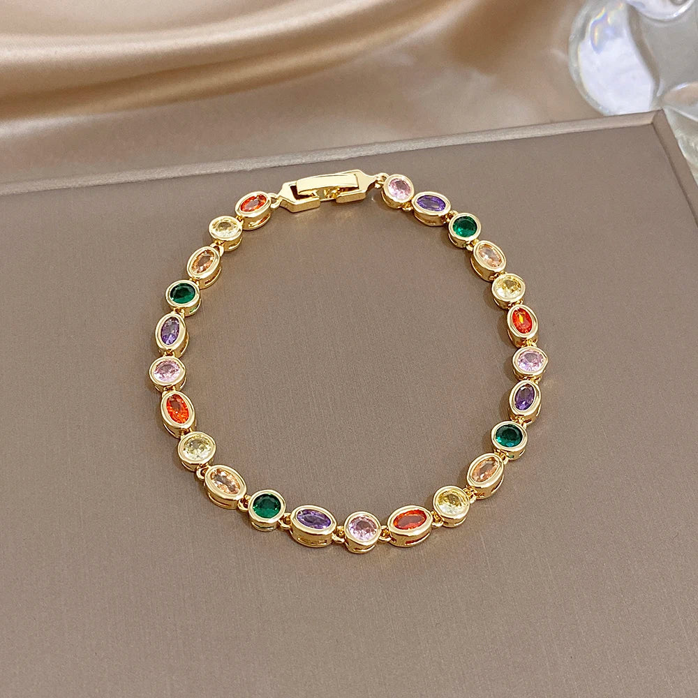 Gold-plated chain bracelet with multicolor oval zircon stones and rectangular clasp