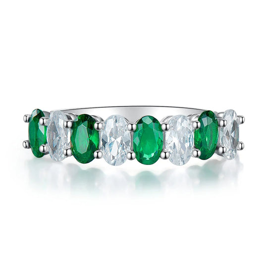 Silver tone women's band ring with alternating green and white oval cubic zirconia stones