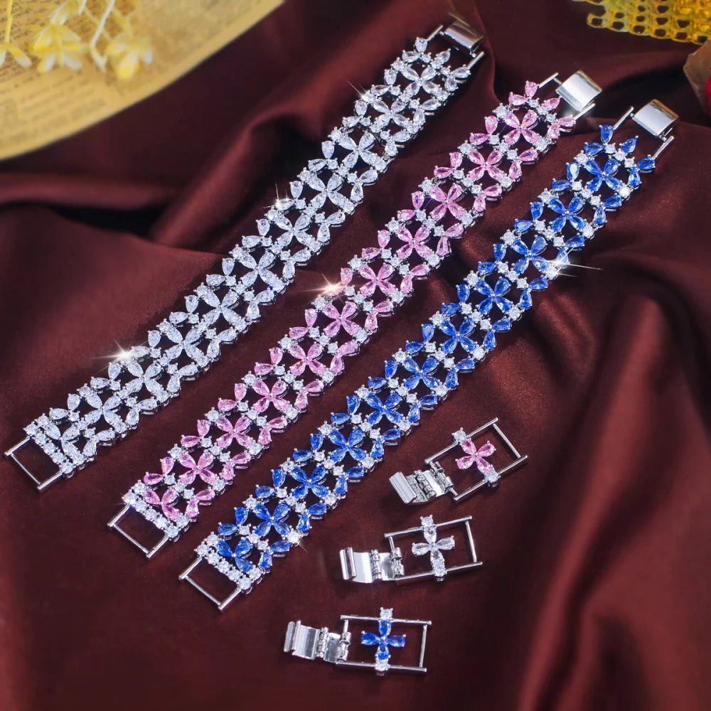 Wide floral crystal tennis bracelets in clear, pink, and blue with clasp extensions
