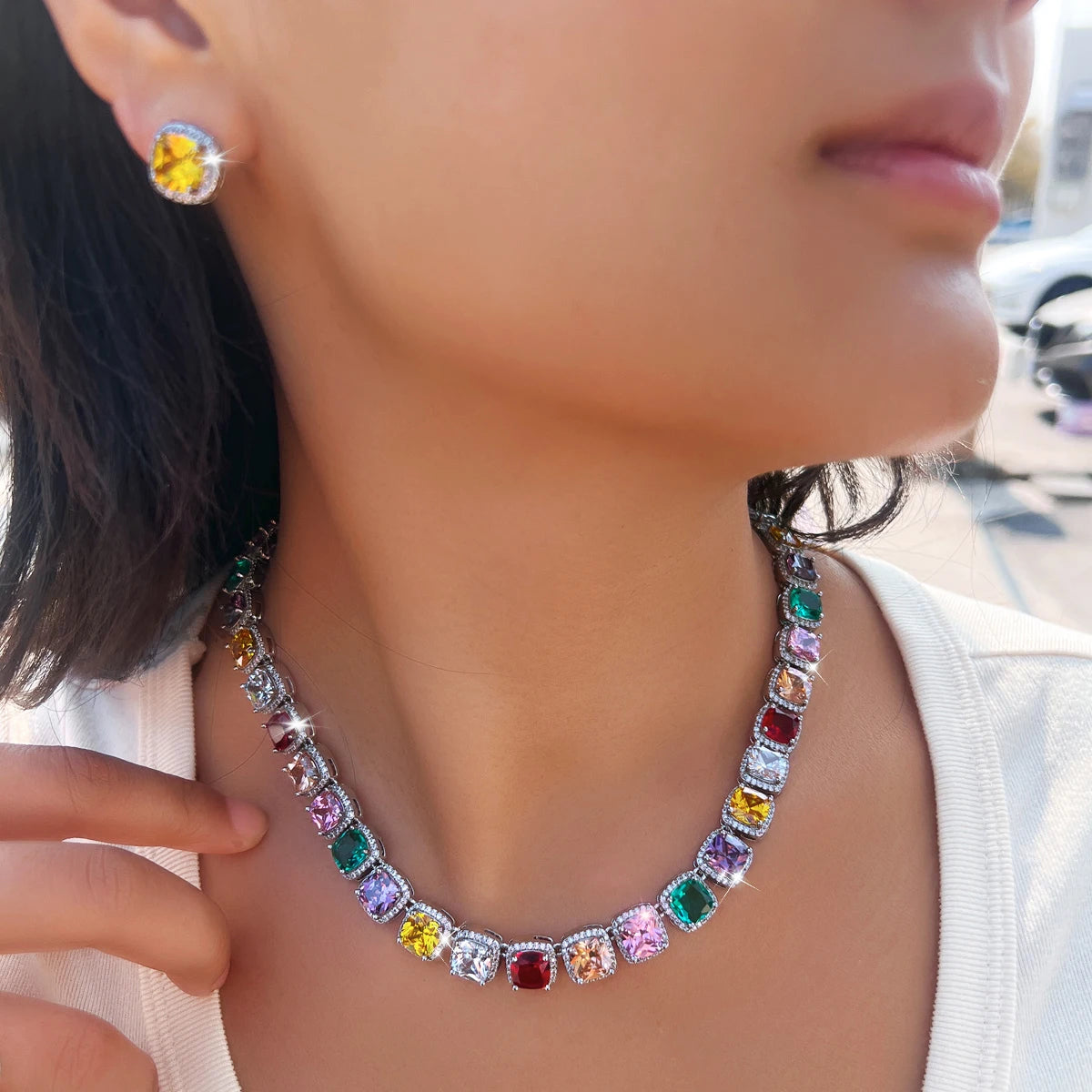 Multicolor square zirconia necklace and matching stud earrings worn together