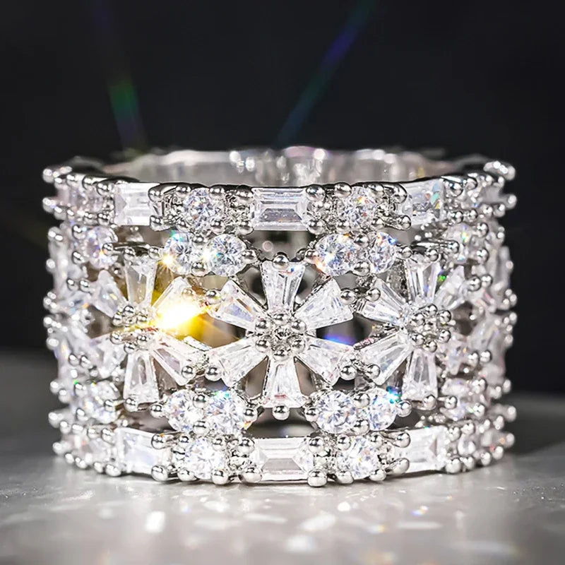 Wide square CZ ring with clear stones and open center, silver-toned frame