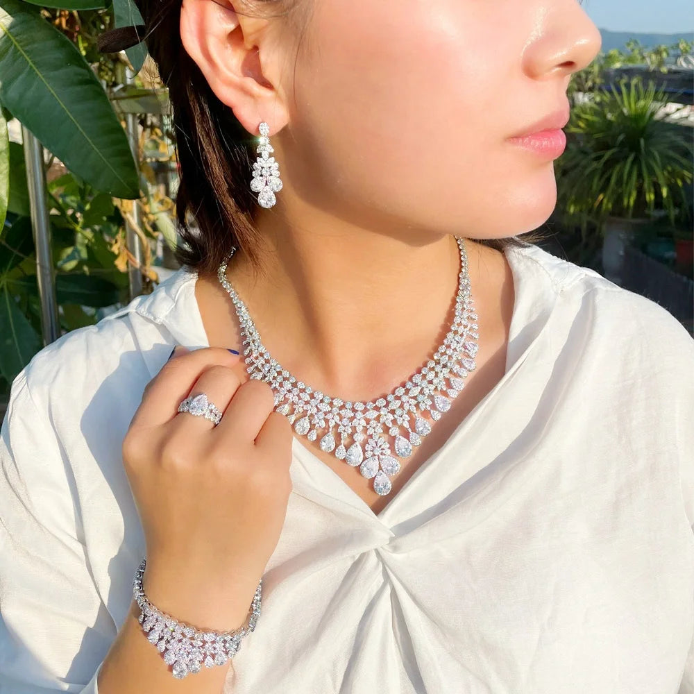 Bridal jewelry set with rhinestone necklace, earrings, ring, and bracelet on model