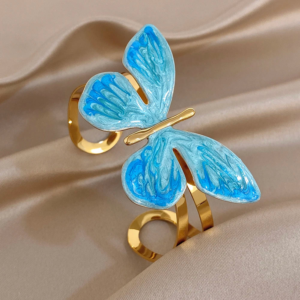 Gold-plated wide cuff bracelet with blue enamel butterfly wings and pearl