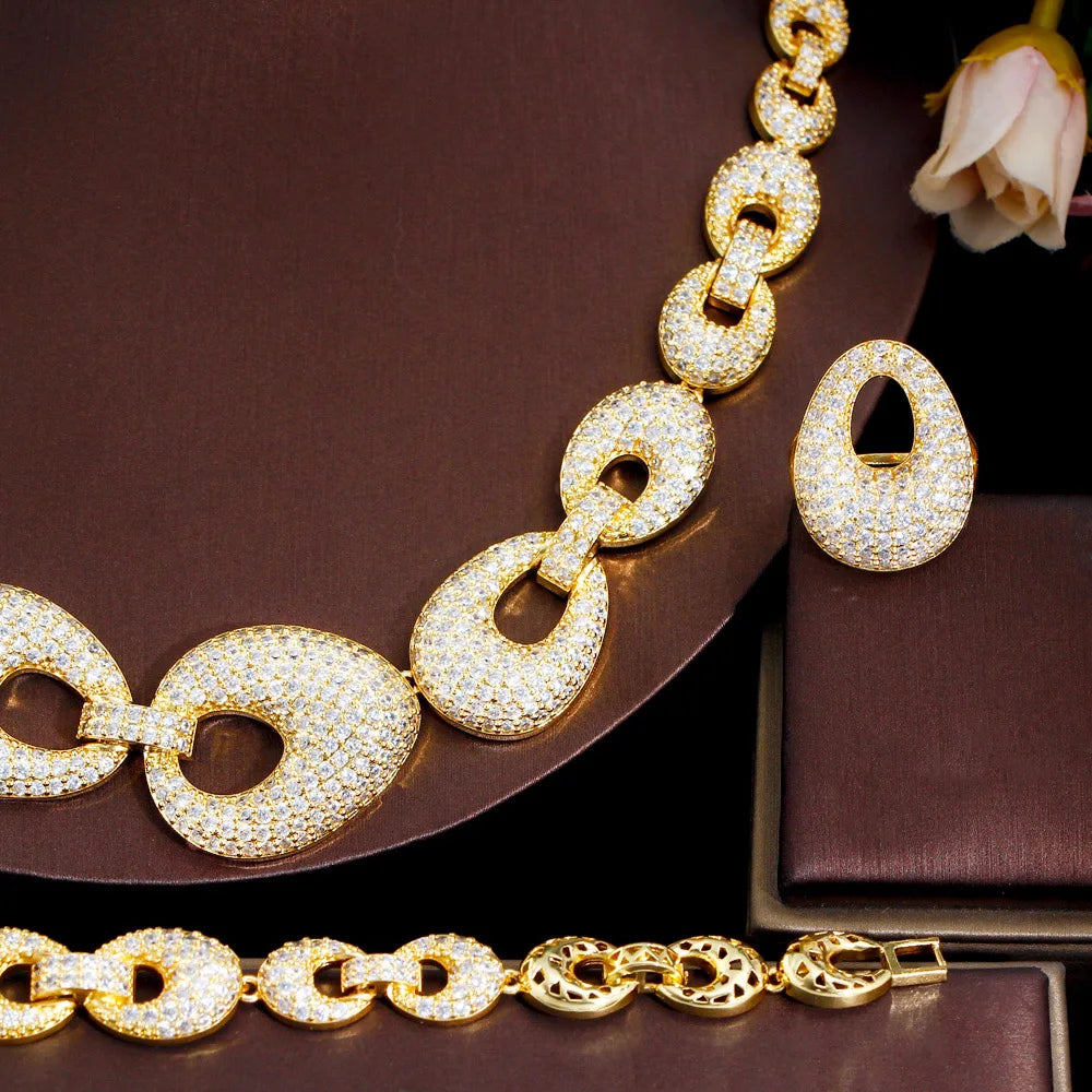 Gold-tone zirconia chain link necklace with matching hoop earrings and bracelet