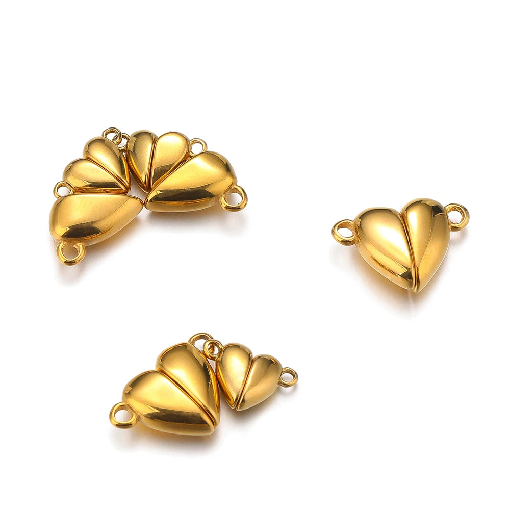 Gold heart magnetic clasp connector pair, shiny heart halves with two ring loops.
