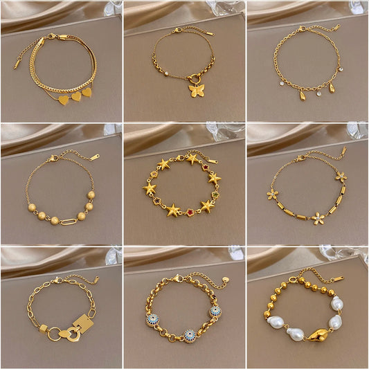 Gold-tone slim chain charm bracelets with heart and star motifs