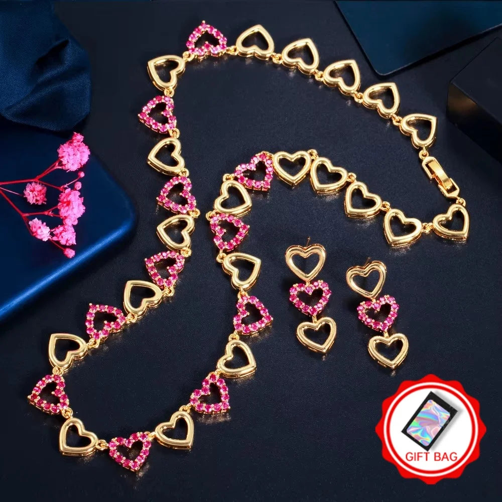 Gold-tone heart necklace and earrings with pink stones