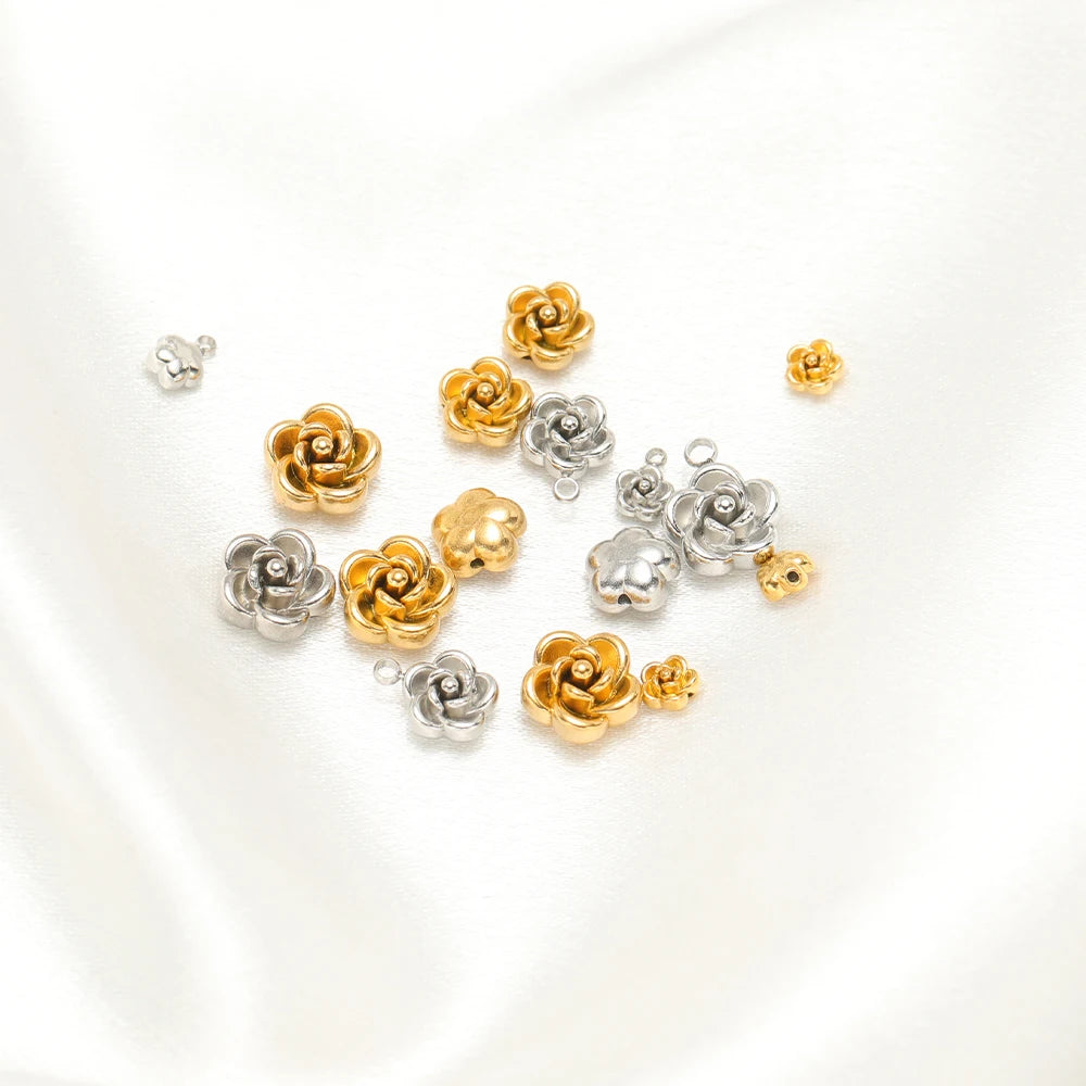 Small rose flower charm pendants in gold and silver tones, assorted pieces