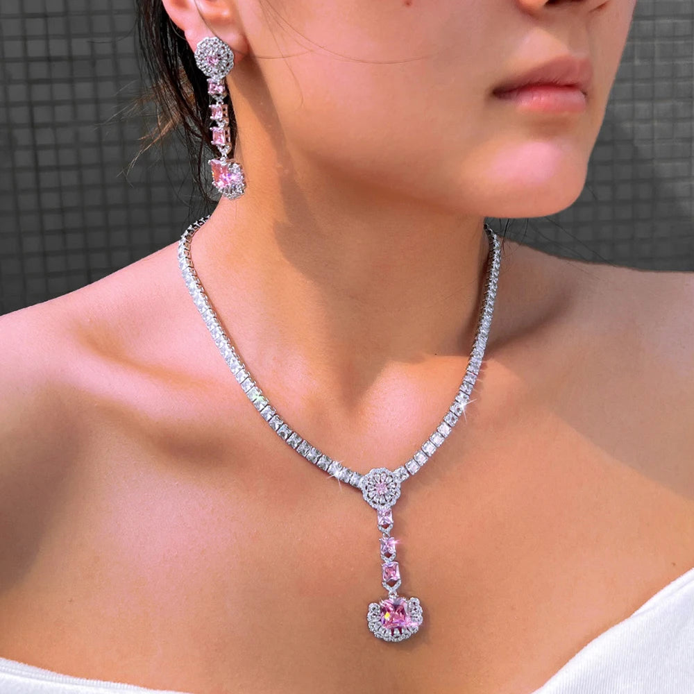 Pink zirconia drop earrings and necklace with teardrop pendant, silver-tone prong settings