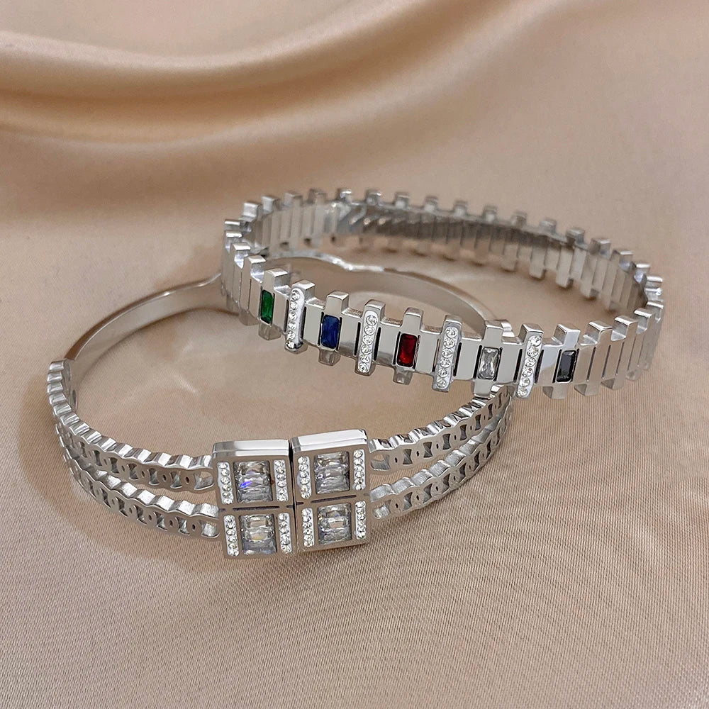 Pair of silver-toned geometric zircon cuff bracelets with multicolor bar insets